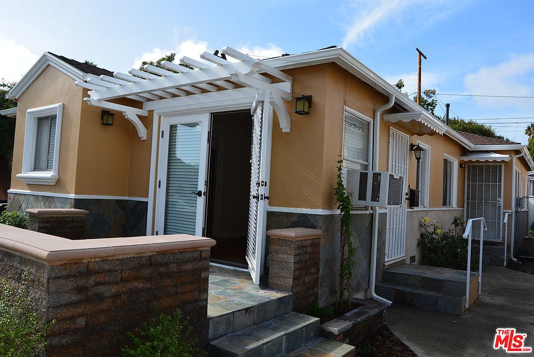 Entry to the front unit with french doors and stone planter