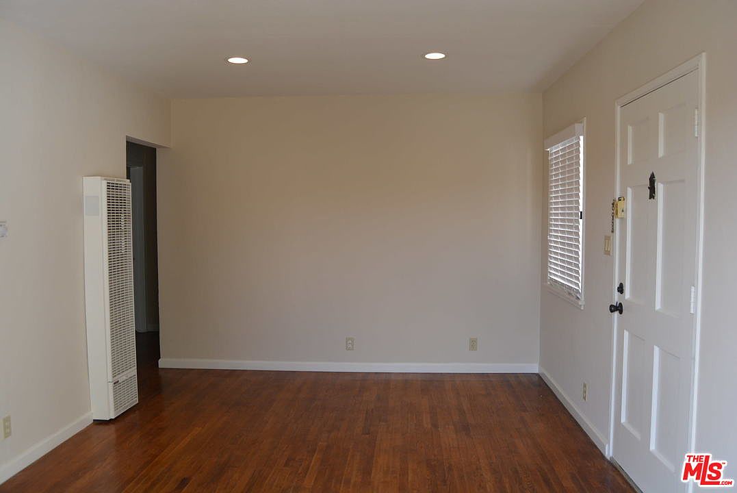 Living room of a unit with hardwood floors